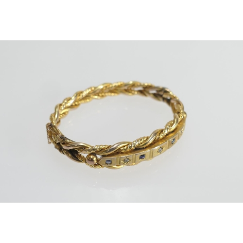 20 - Late Victorian or Edwardian diamond and sapphire set gold plated hinged bangle, formed as double twi... 