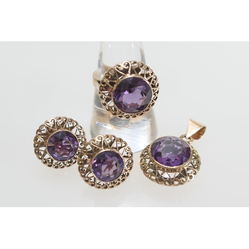 27 - Suite of amethyst jewellery comprising dress ring with 11mm diameter amethyst in an openwork setting... 