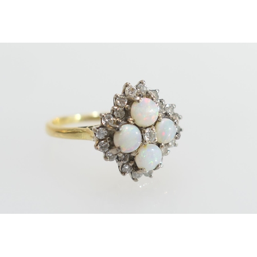 34 - Opal and diamond cluster ring, set with four cabochon round opals, centred and bordered with small b... 