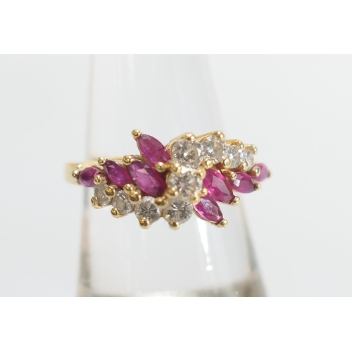 37 - Diamond and marquise ruby cluster ring, centred with nine brilliant cut diamonds totalling approx. 0... 