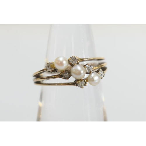 38 - Diamond and pearl trinity ring, set with three small pearls of approx. 3mm diameter flanked by six c... 