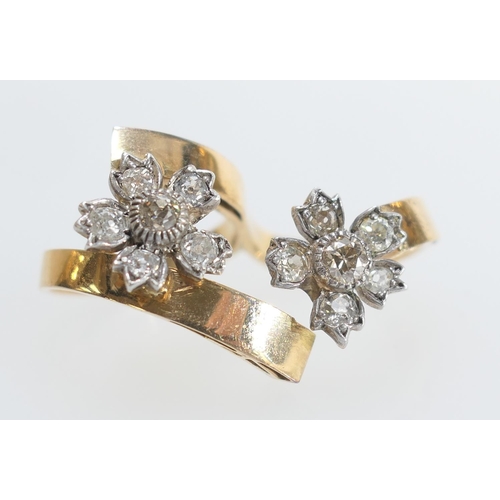 50 - 18ct yellow gold and diamond double finger ring, set with two flowerhead diamond clusters with old r... 