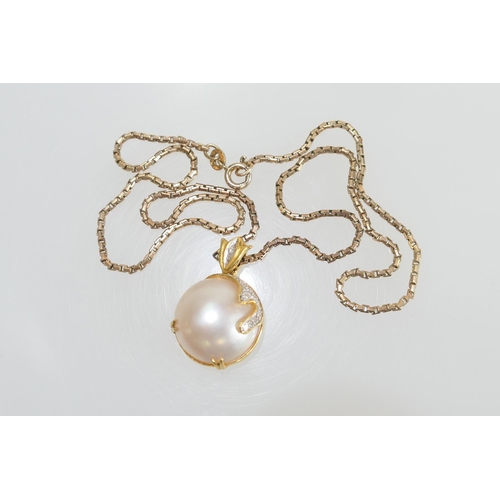 58 - Diamond and Mabe pearl pendant, the pearl approx. 18mm diameter, set with tiny brilliants in unmarke... 