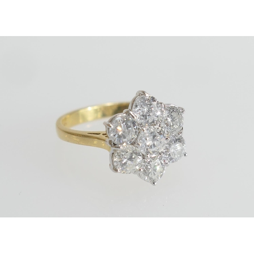 6 - Diamond cluster ring, set with seven well matched brilliant cut diamonds in a flowerhead design, col... 