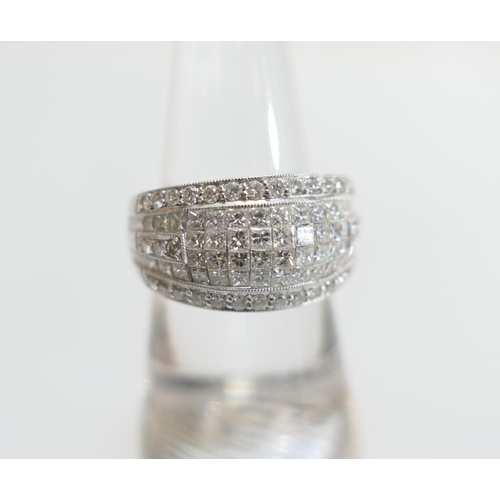 69 - Diamond pave cluster ring, set with small princess cut and round cut diamonds, totalling approx. 1.9... 