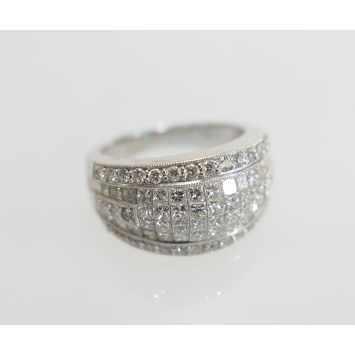 69 - Diamond pave cluster ring, set with small princess cut and round cut diamonds, totalling approx. 1.9... 