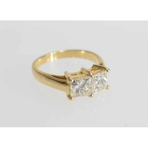 7 - Diamond ring, set with two princess cut stones of approx. 1ct each, colour estimated as K/L, clarity... 