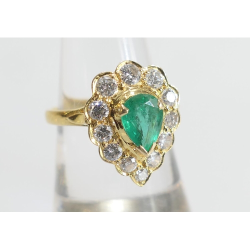 8 - Emerald and diamond cluster ring in 18ct yellow gold, central pear cut emerald of approx. 1ct, surro... 