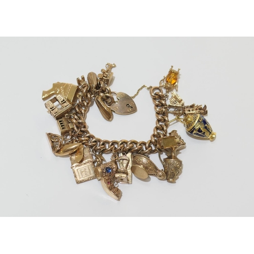 84 - 9ct gold charm bracelet comprising two 18ct gold charms, one 14ct gold charm, one 10ct gold charm, f... 