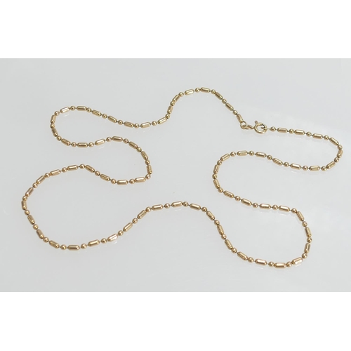 92 - 9ct gold bead and baton necklace, length 61cm, weight approx. 10g