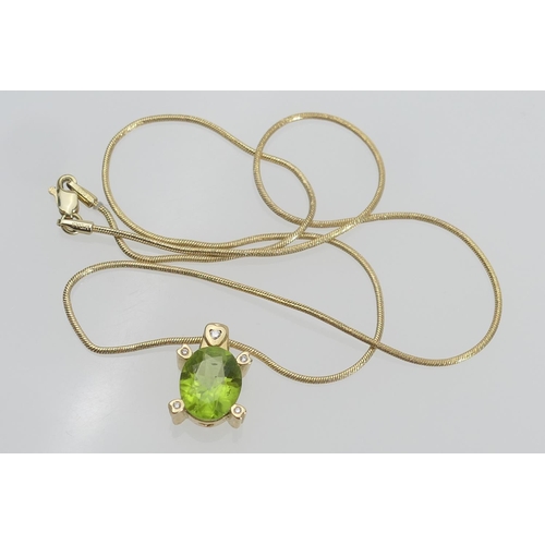 124 - Peridot and diamond pendant necklace, in 18ct yellow gold, the oval peridot of approx. 3cts bordered... 