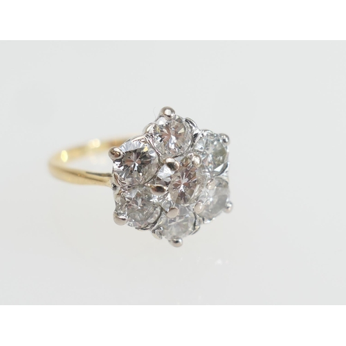 129 - Diamond cluster ring, the central brilliant cut stone of approx. 0.7ct, colour estimated as L/M, piq... 