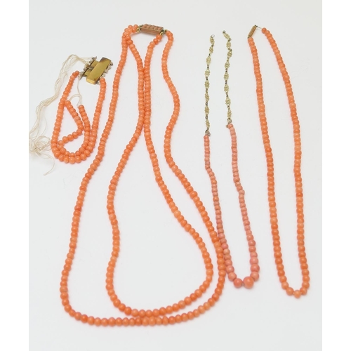 138 - Coral bead double row necklace, united with a coral set yellow metal clasp, length 53cm; also a cora... 