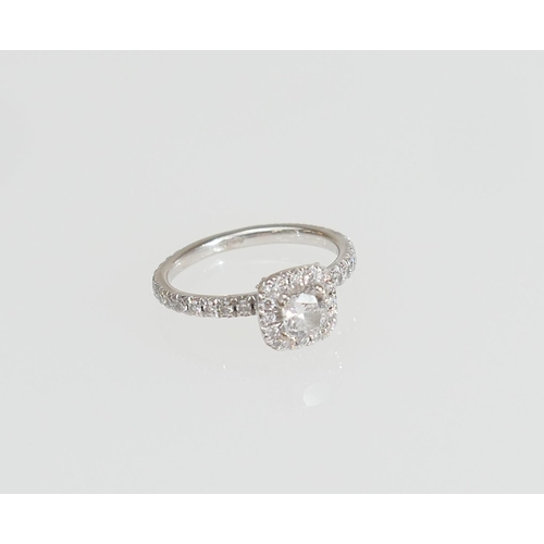 149 - Beaverbrooks certificated 'Maple Leaf Diamonds' ring, the central cushion cut stone of 0.35ct, being... 