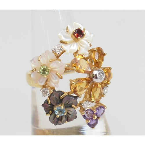 150 - Diamond and multi-gem set floral bouquet ring in 18ct gold, worked with flowerheads in topaz, mother... 