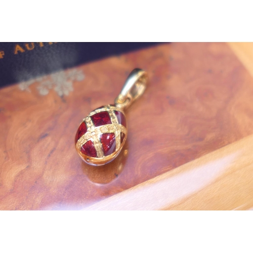 156 - Victor Mayer, Faberge, 18ct yellow gold and red enamelled egg pendant (Ref: F2419) limited edition, ... 