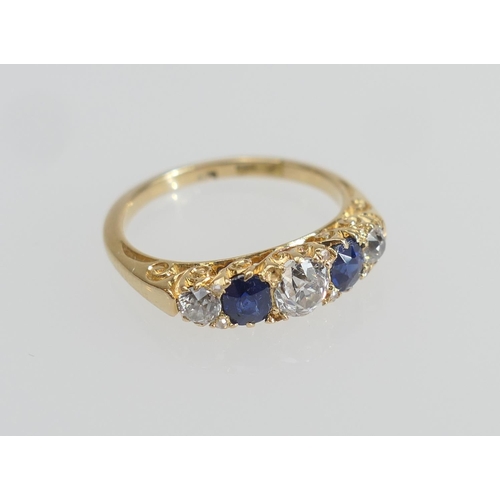 172 - Sapphire and diamond five stone ring in 18ct yellow gold, the central old round cut diamond of appro... 