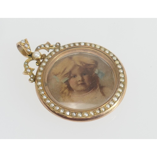 178 - Edwardian gold and pearl double picture locket, circular form bordered with a single row of seed pea... 