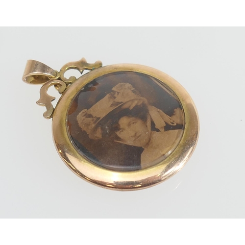 178 - Edwardian gold and pearl double picture locket, circular form bordered with a single row of seed pea... 