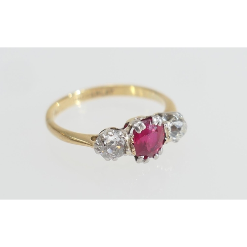 201 - Synthetic ruby and diamond three stone ring, the central cushion cut ruby of approx. 0.5ct, flanked ... 