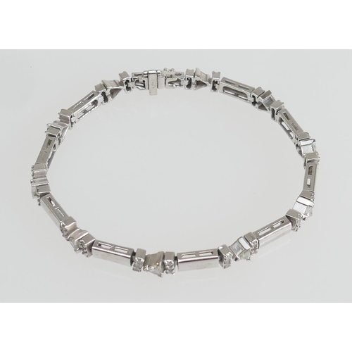 217 - Art Deco style trilliant diamond bracelet in 14ct white gold, set with ten triangular cut diamonds a... 