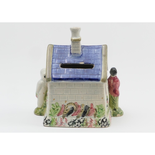 331 - Yorkshire Prattware cottage money box, Mexborough Pottery, circa 1810, the cottage flanked by two fi... 