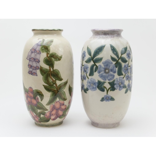 380 - Two Cobridge Stoneware vases, decorated with wild flowers, signed 'LM', height 22cm