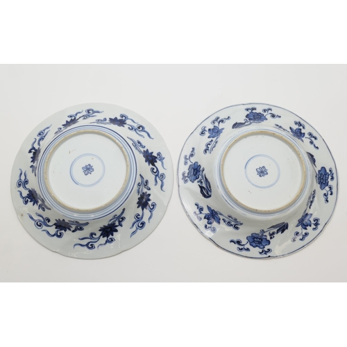 403 - Pair of Chinese blue and white dishes, Kangxi (1662-1722), wrythen moulded borders detailed with a m... 