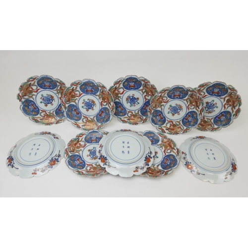 408 - Ten Japanese imari plates for the Chinese market, decorated with phoenix and flowering vases in typi... 