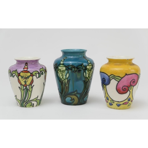 409 - Three Mintons Secessionist small vases, circa 1900, one having a yellow ground and decorated with st... 