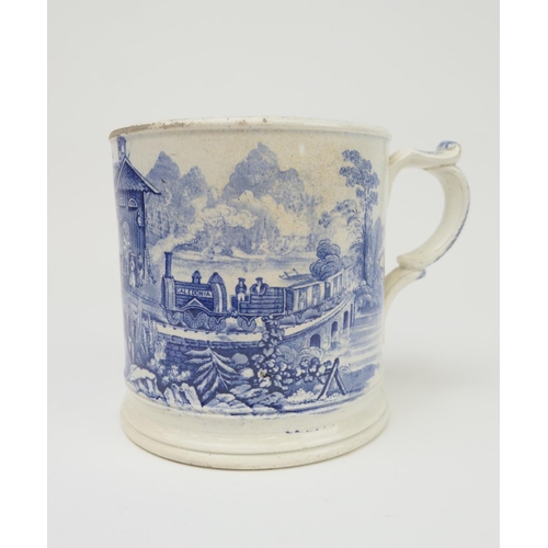 419 - Railway interest: Large blue and white printware tankard decorated with a train 'The Caledonia', on ... 