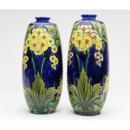 424 - Matched pair of Minton Secessionist vases, circa 1900, decorated with stylised yellow flowers with g... 