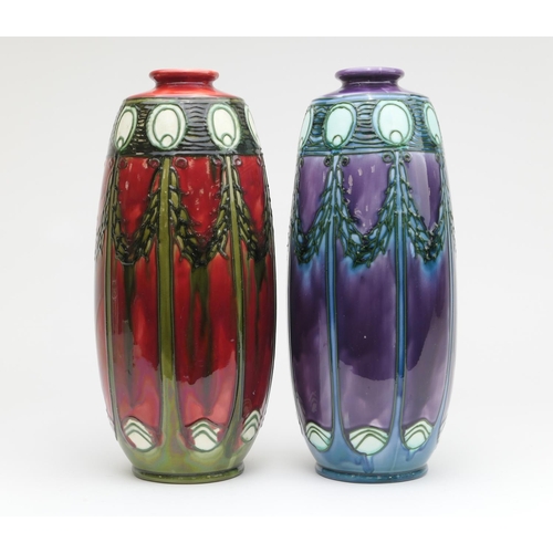 427 - Two Minton secessionist ovoid vases, circa 1900, each decorated with stylised peacock feather and la... 