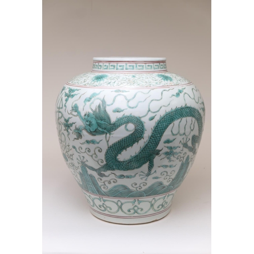 466 - Chinese Guan jar, in Ming style, 20th Century, decorated with dragons in green, flying amidst clouds... 