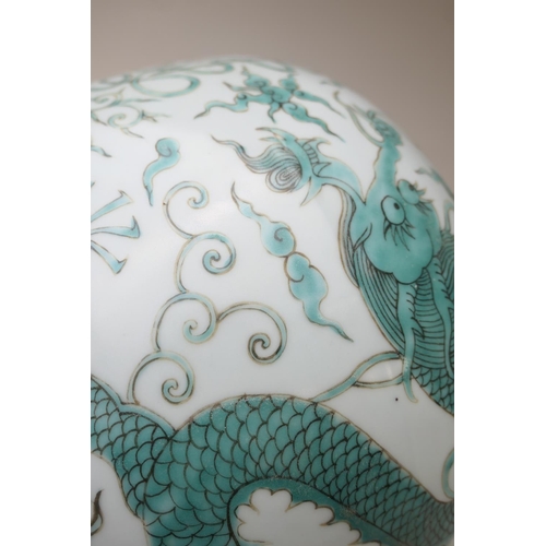 466 - Chinese Guan jar, in Ming style, 20th Century, decorated with dragons in green, flying amidst clouds... 