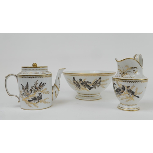 475 - Paris porcelain teapot, milk jug and slop basin, 19th Century, decorated with birds amidst gilt bran... 