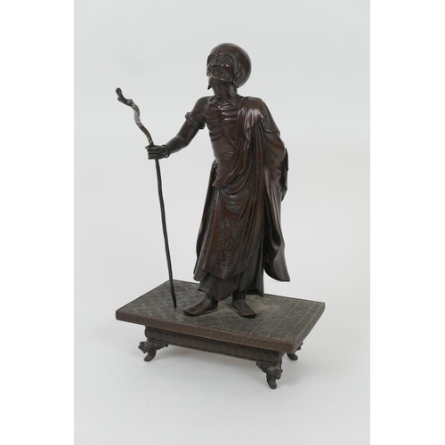 781 - Japanese bronze figure of a blind traveller, Meiji (1868-1912), the elderly man holding a staff (dam... 