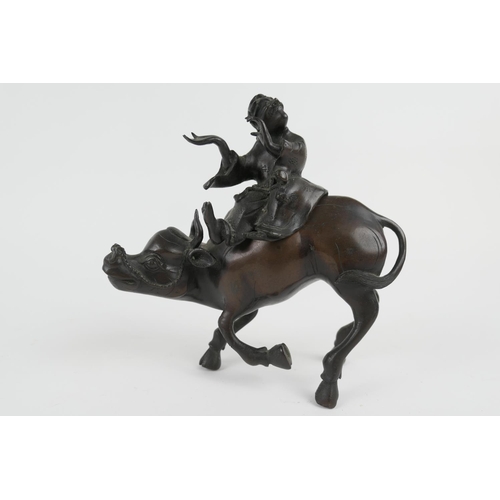 802 - Chinese bronze koro, formed as a man riding a water buffalo, circa 1900, height 19cm