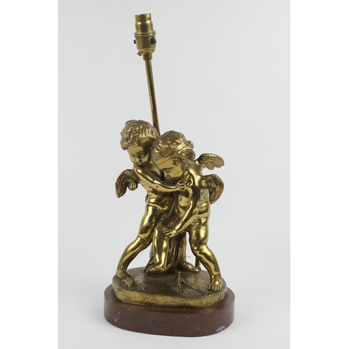 826 - French gilt ormolu lamp base, cast as Cupids quarrelling over a burning heart, mounted on a scagliol... 