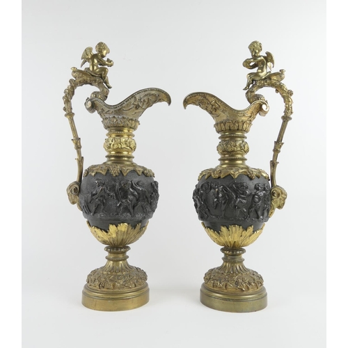 829 - Pair of Renaissance style cast brass and bronze ornamental ewers, in the manner of Clodion, late 19t... 