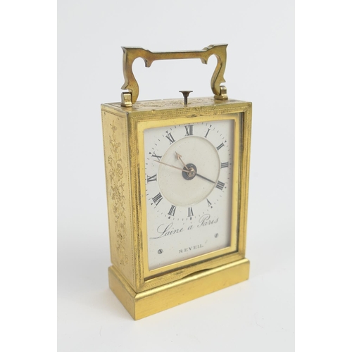 885 - French brass travelling alarm clock by Laine a Paris, floral chased and brass case, the painted dial... 