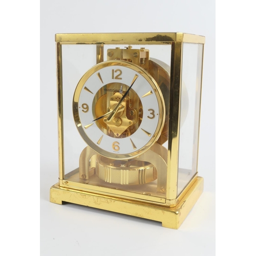 891 - Jaeger-LeCoultre brass Atmos clock, white chapter ring with Arabic and baton numerals, height 22.5cm... 