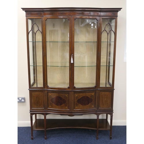 942 - Late Victorian or Edwardian mahogany and inlaid bowfront display cabinet, retailed by Maple & Co., c... 