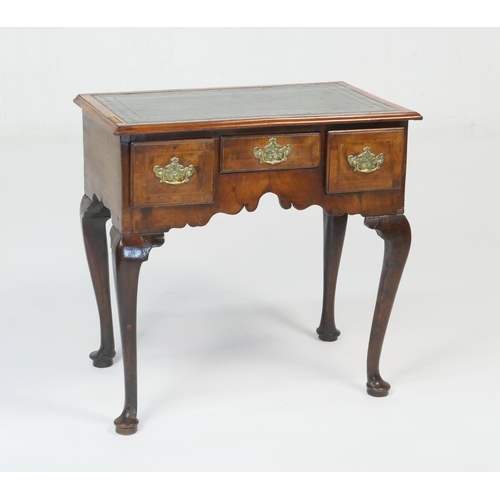 945 - Walnut lowboy, in part 18th Century with later alterations, the top with later inset leather writing... 