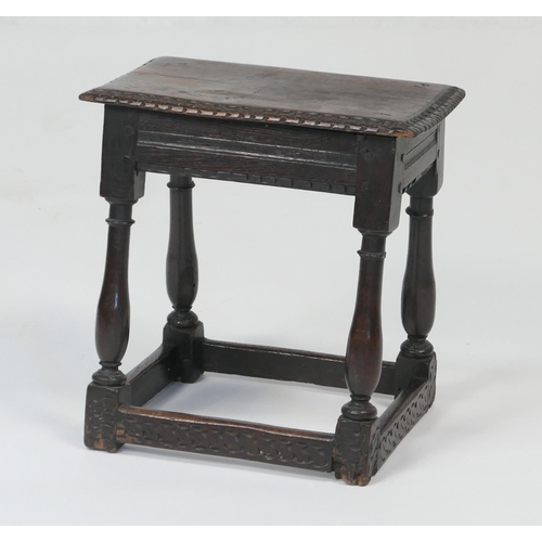 947 - Oak joint stool, late 17th Century, the top with chip carved border, raised on slender turned balust... 