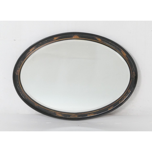 949 - Chinoiserie gilt and black lacquered oval wall mirror, circa 1920, bevelled glass plate, the frame d... 