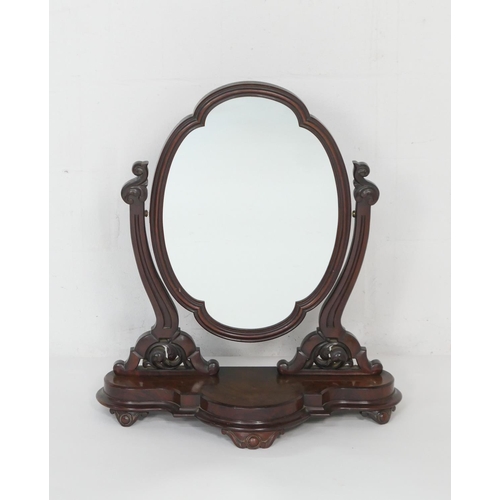 952 - Victorian mahogany toilet mirror, circa 1870, moulded oval plate on carved supports and shaped base,... 