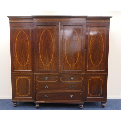 959 - Late Victorian mahogany and satinwood inlaid breakfront press robe, the centre with two recessed pan... 