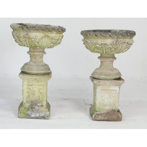 966 - Pair of weathered reconstituted garden pedestal urns, cast with acanthus details, raised on a square... 