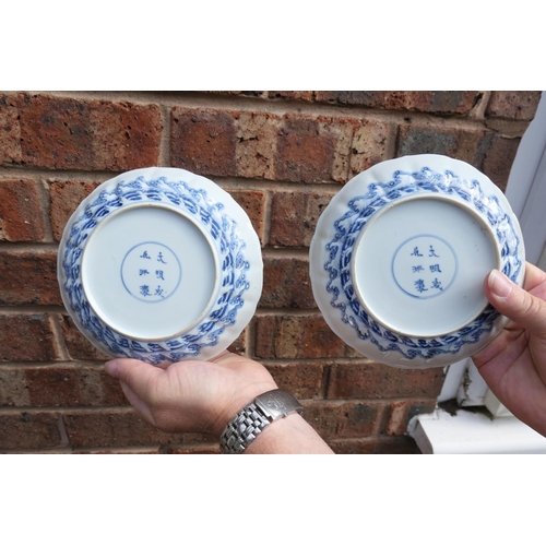 404 - Three Chinese blue and white saucer dishes, Kangxi (1662-1722), each decorated with a central rounde... 